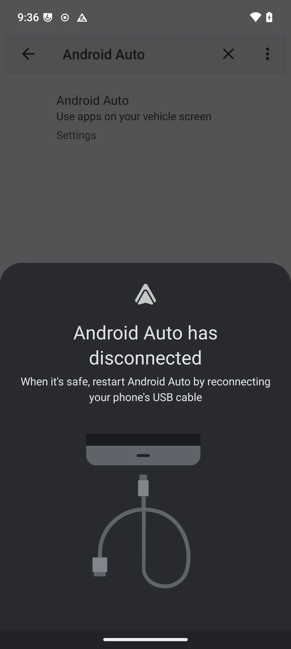 Android Auto’s “Android Auto has disconnected” screen, instructing to reconnect the phone’s USB cable